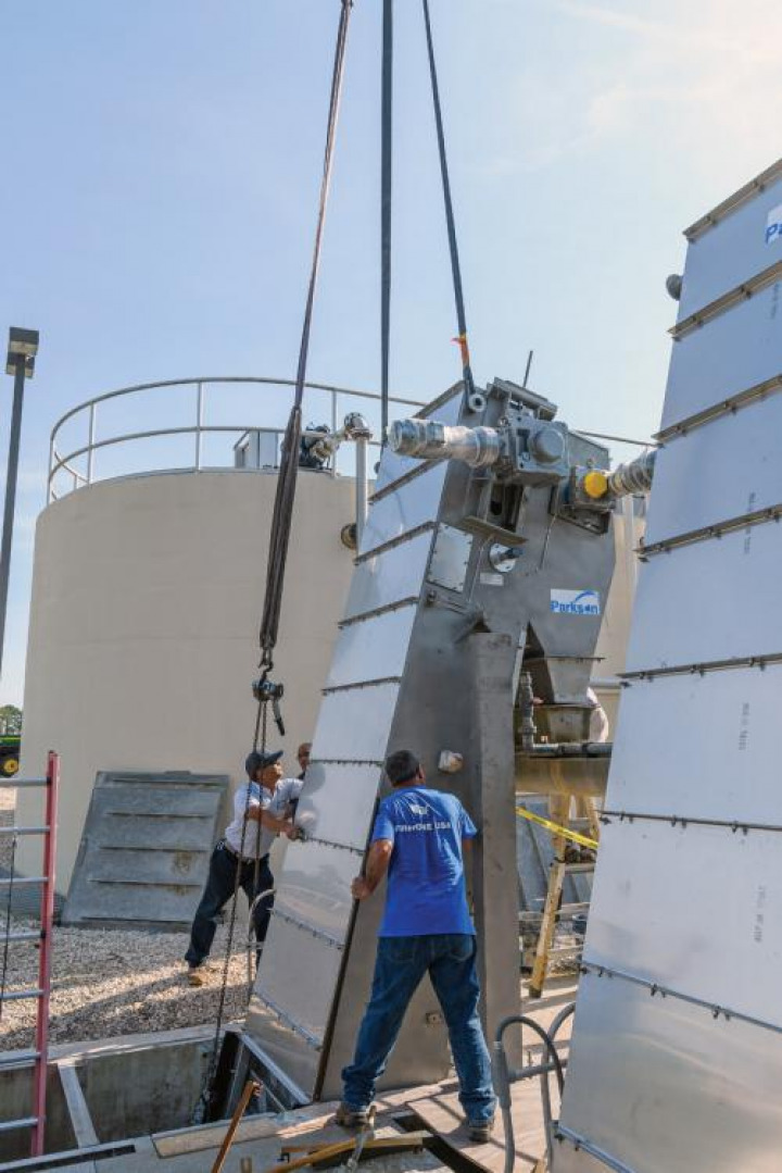 Parkson installers Ryan Brice (left) and Pete Peña install a Parkson perforated bar screen at the Palm Coast Wastewater Treatment and Reuse Facility.